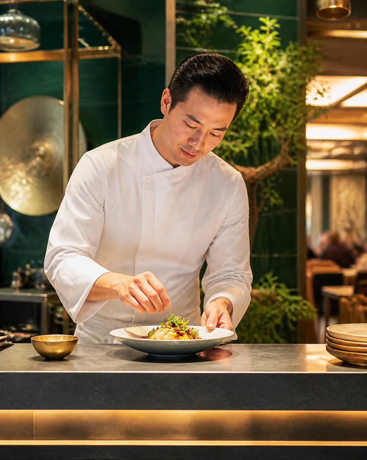 Chef carefully finishing a signature dish
